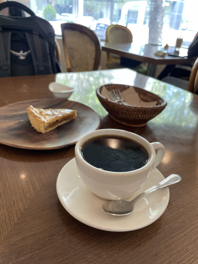 ilya coffee cup and pastry